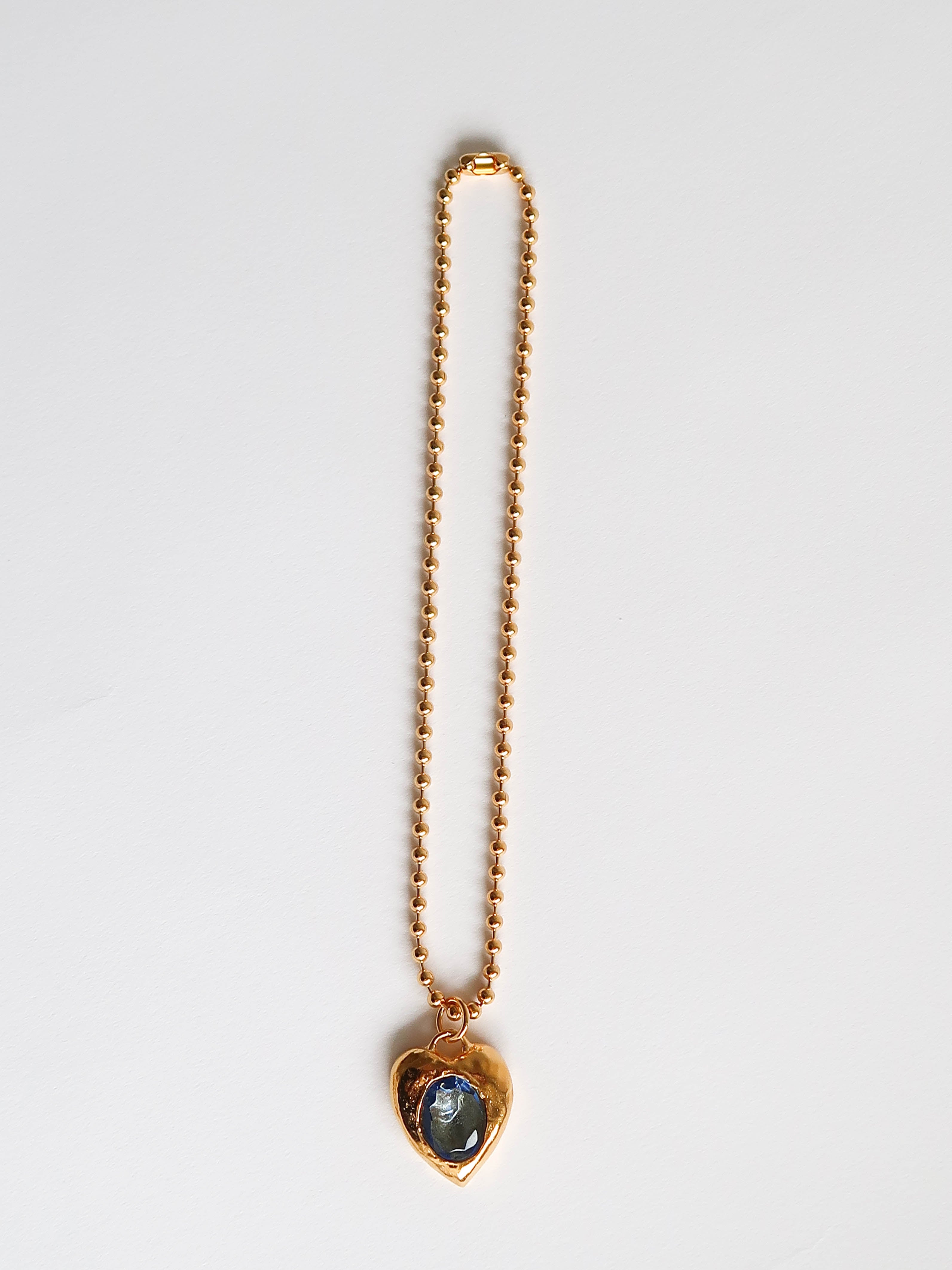 Gold necklace deals with blue stone